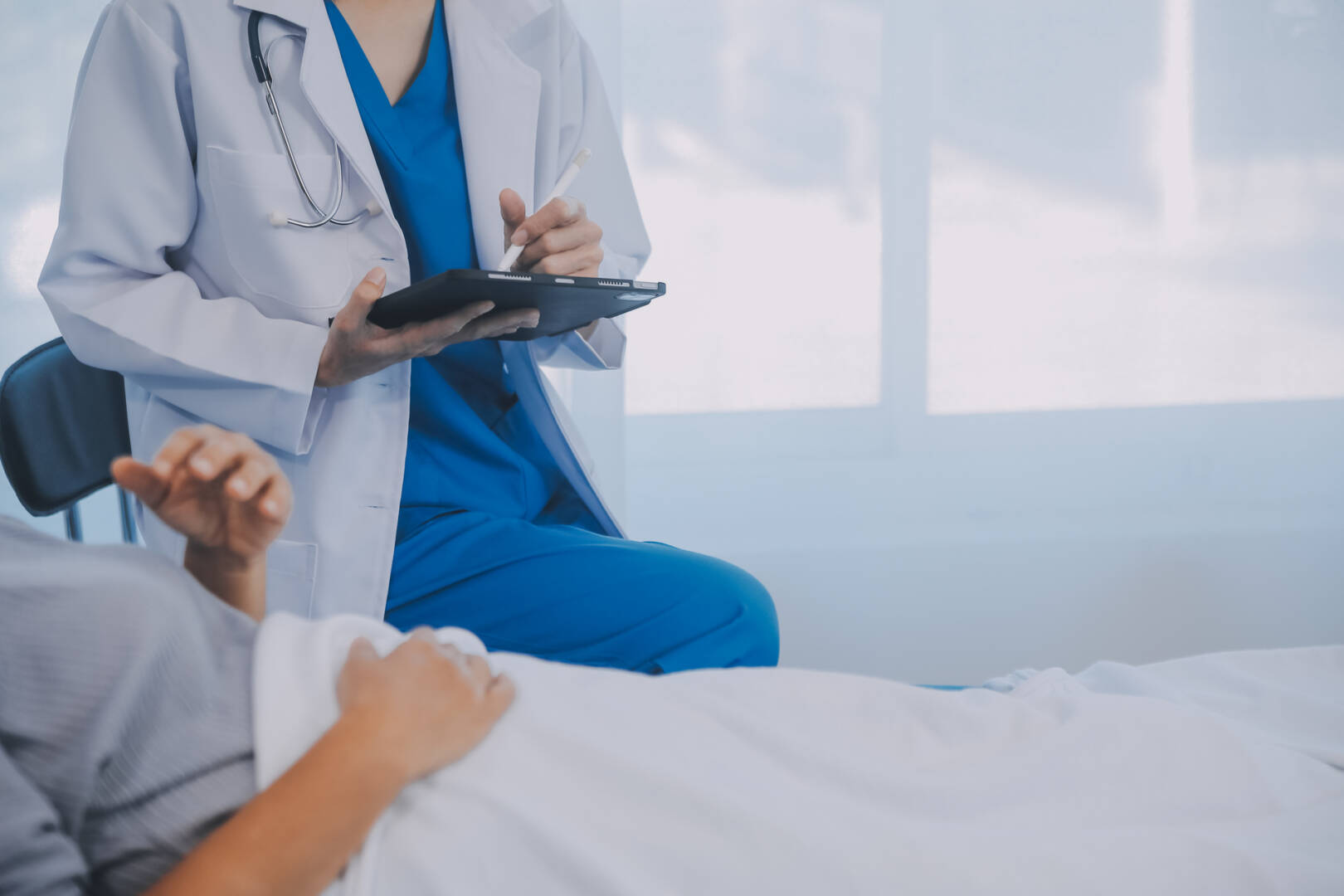 Female doctor administers specialized medical treatment to a pat