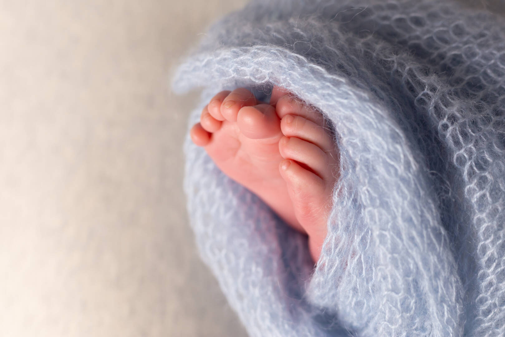 medium-vecteezy_newborn-baby-feet-on-an-oatmeal-background-wrapped-in-a_13039178_medium