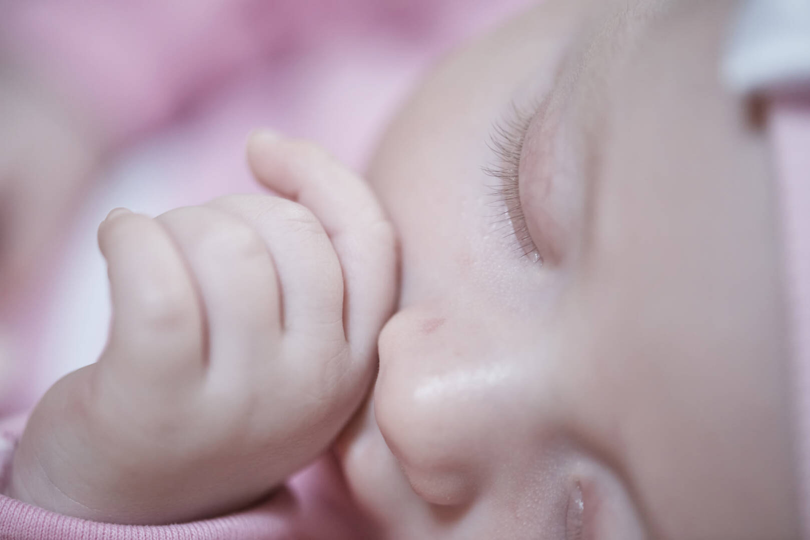 newborn baby sleeping  at home in bed