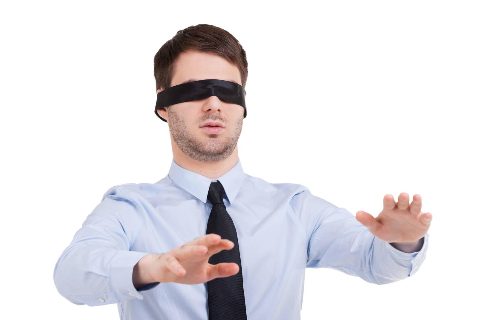 See no opportunity. Young businessman in blindfold stretching out hands while standing isolated on white