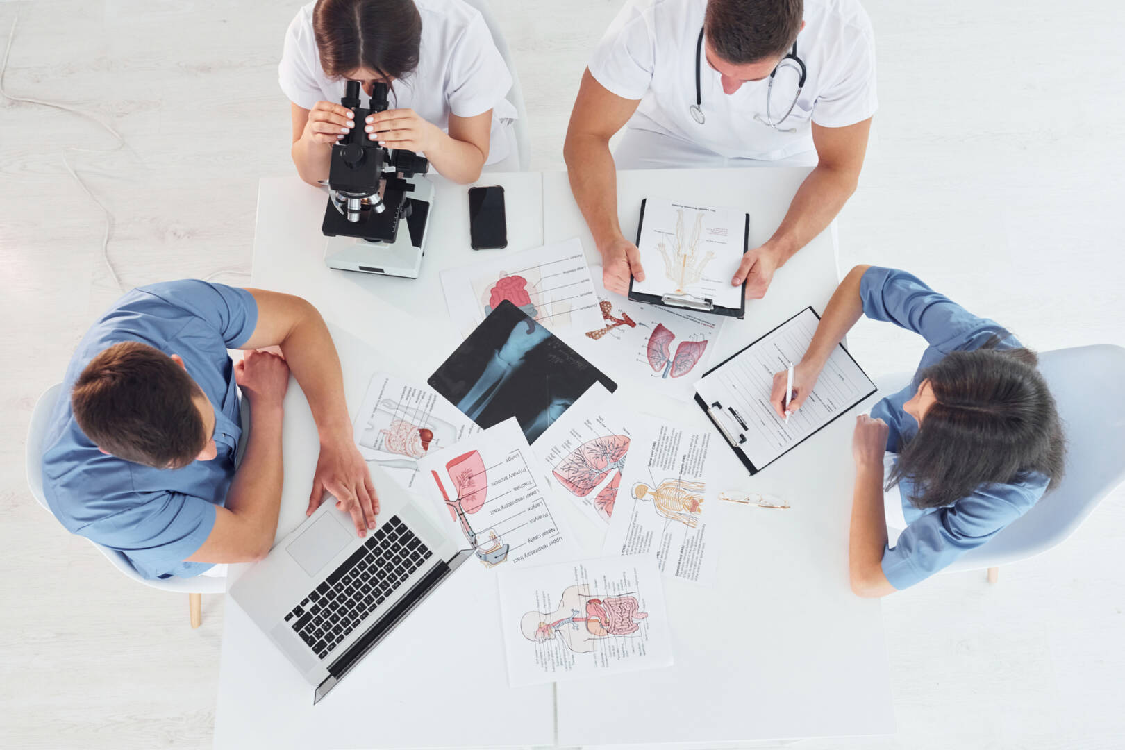Top view. Group of young doctors is working together in the modern office