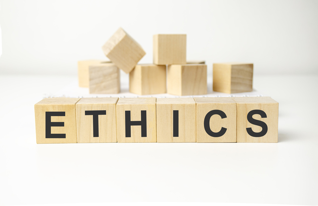 Ethics - words from wooden blocks with letters, ethics moral philosophy concept,