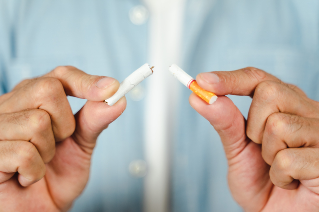 Man hand crushing cigarette, Concept Quitting smoking,World No T